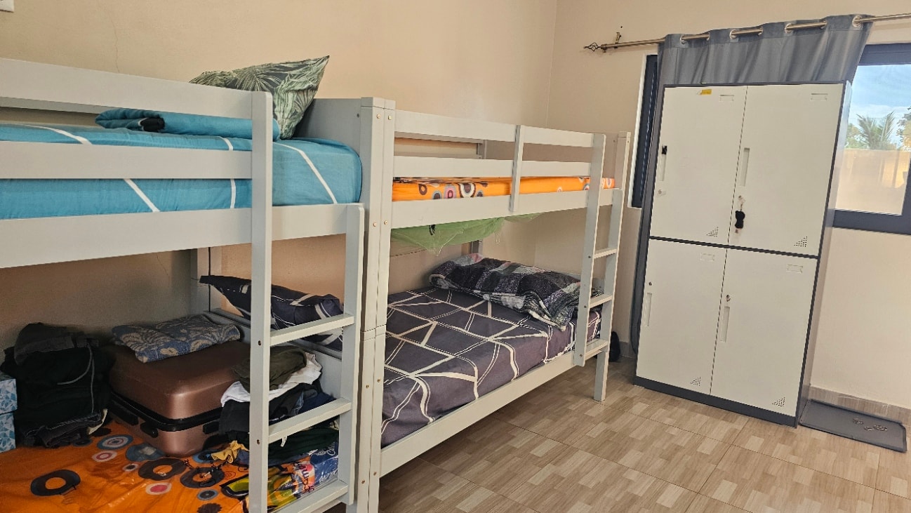 MGIS boarding room showing bunk beds and personal storage lockers