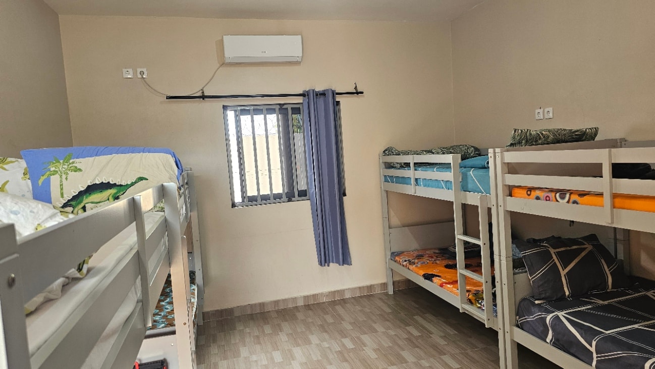MGIS boarding hostel room with bunk beds and window