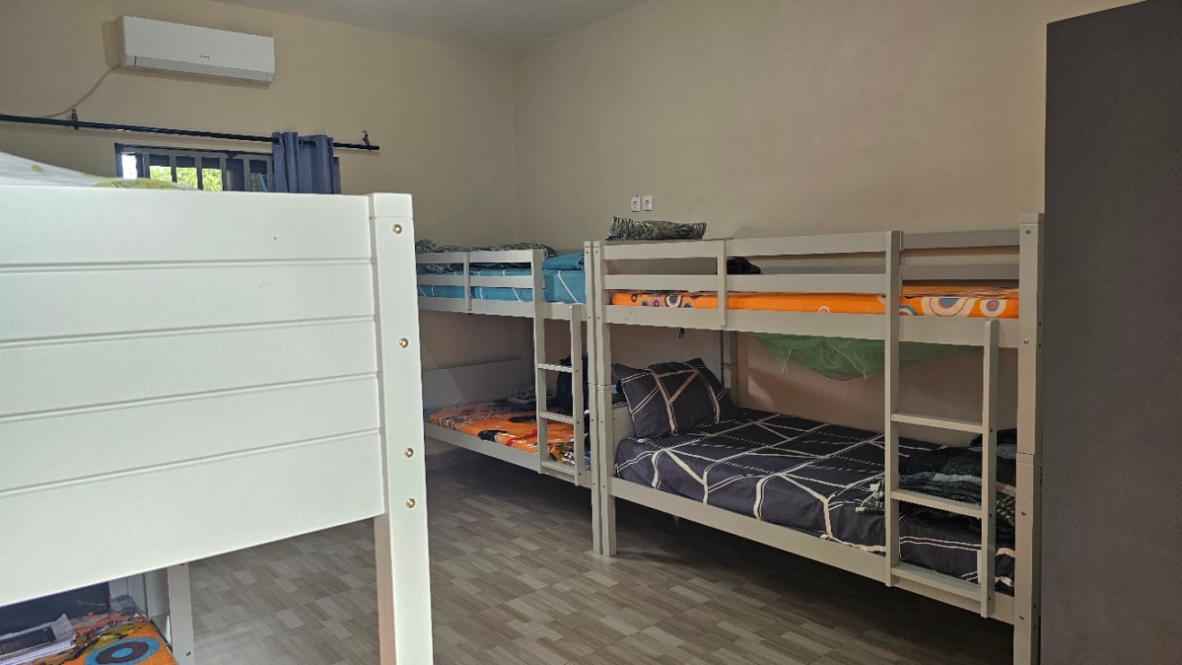 MGIS boarding room with multiple bunk beds and wardrobe