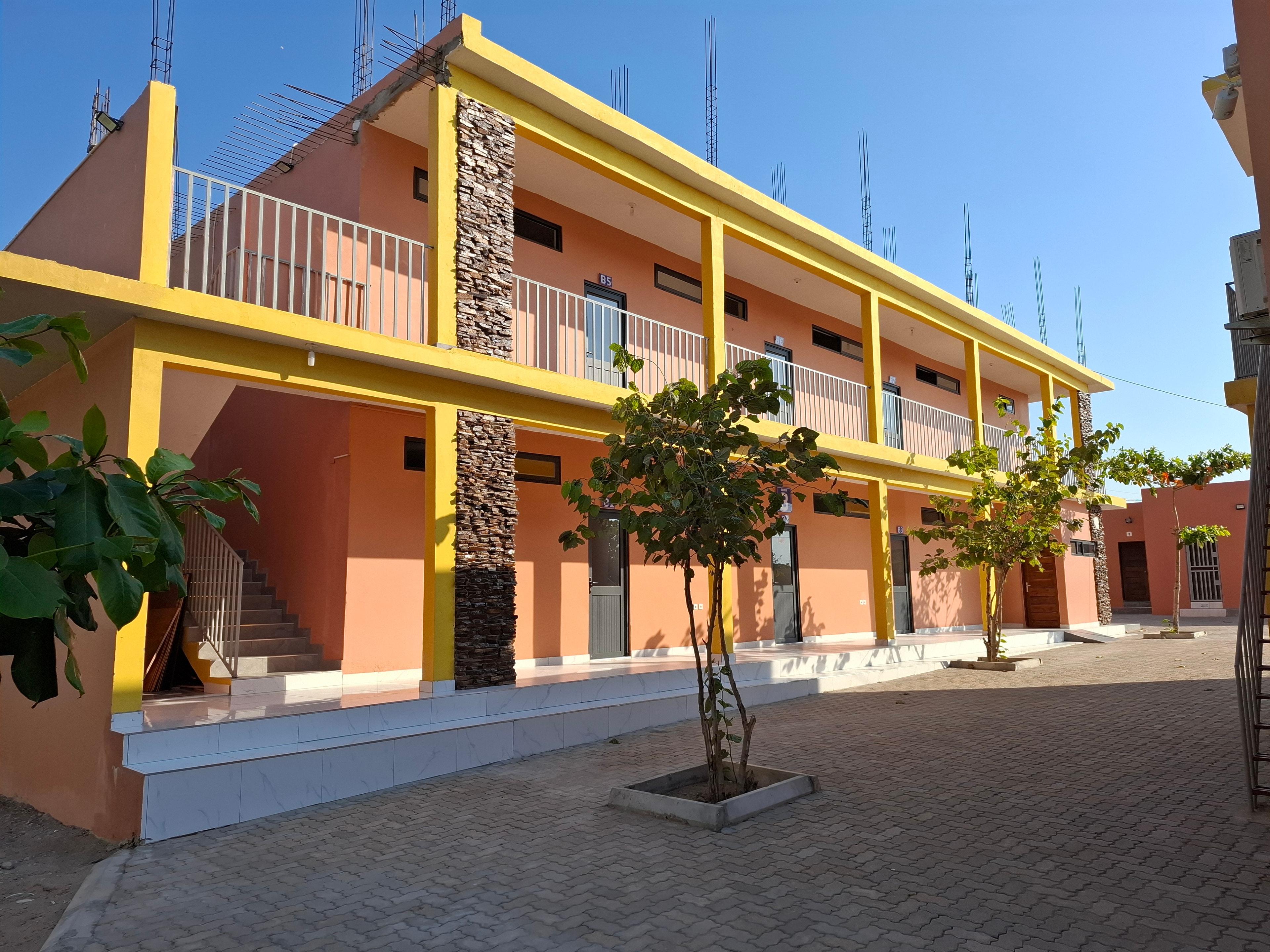 MGIS Block B building with covered walkways and landscaped courtyard