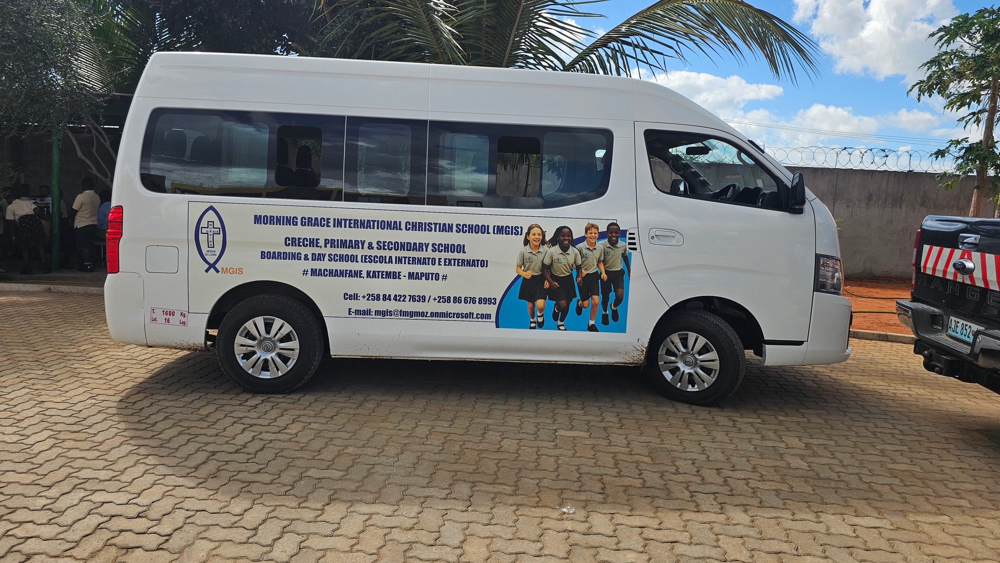 Morning Grace International School branded school bus on campus
