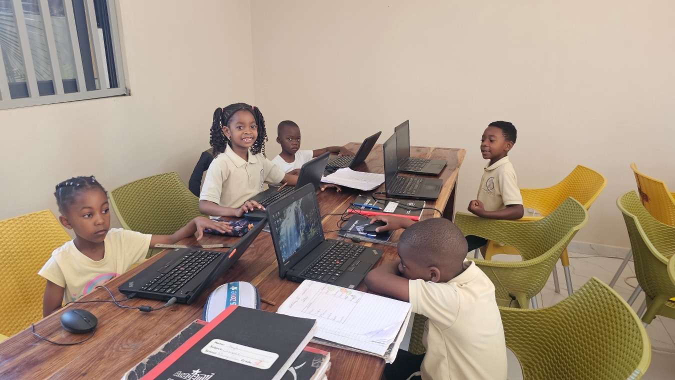 MGIS Grade 1 students using laptops during a computer lesson in the classroom